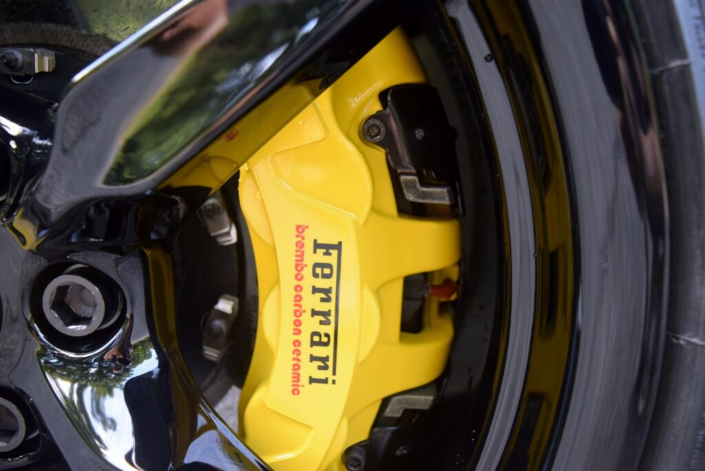 Ferrari F8 Tributo yellow brake caliper on carbon-ceramic brakes